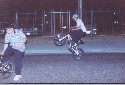 Jorge "Korn" popping a wheelie (showing off) with his GT bike and Chris (left side) trying to do a trick. haha